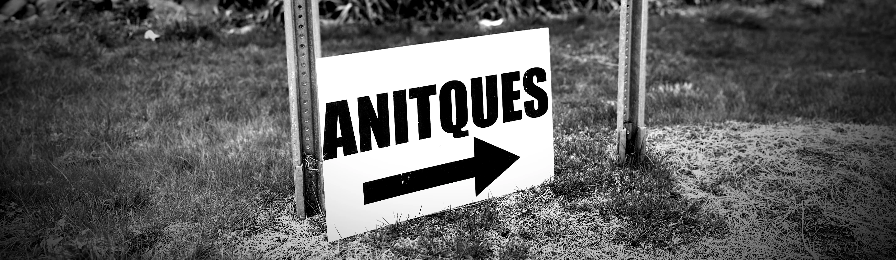 A sign advertising for antiques, but misspelled.